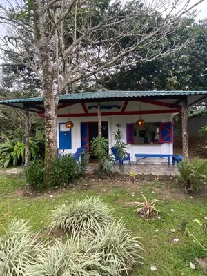 a house with a blue and white at Jicote finca de ecoturismo 1 in Paraíso
