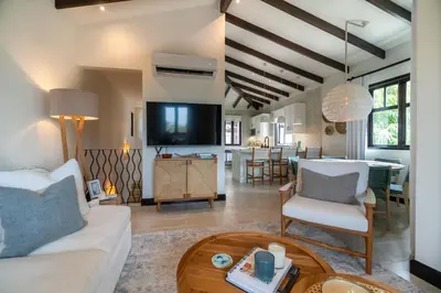 a living room with a couch and a table at Casa Ronda 18 -Las Catalinas in Playa Danta