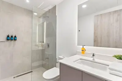 a bathroom with a sink and a toilet and a shower at Luxury Oceanview Condo with Pool in Tamarindo