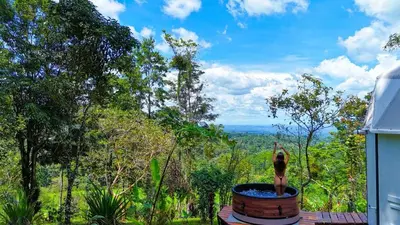 a woman is standing in a pot of water at Selva Partners Chachagua