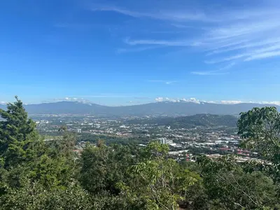 a view of a city with mountains in the distance at El Cabanon del Higuerón in Santa Ana