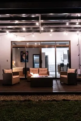 a living room with a couch and two chairs at La Danta Lodge - Celeste River in Bijagua