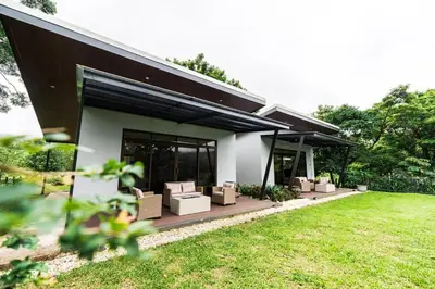 a house with a bunch of boxes on a patio at La Danta Lodge - Celeste River in Bijagua