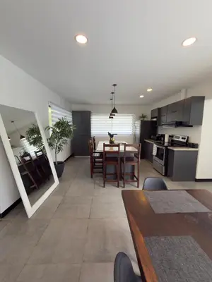 a kitchen and dining room with a table and chairs at Casa Luna in Santa Cruz