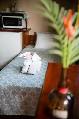a hotel room with two rolls of toilet paper on a bed at Aloha surf Nosara - Kahala Hui Cabanas #1 in Nosara