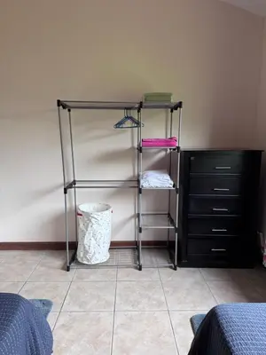 a room with a shelf and a dresser at Birds of a Feather 2BR2BA Ocotal Coastal Retreat in Ocotal