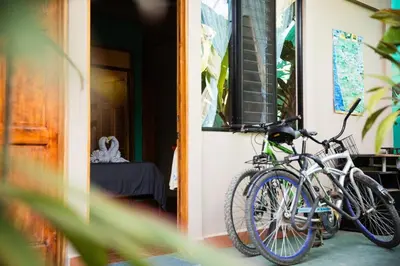 two bikes parked on the side of a house at Aloha Surf Nosara - Kahala Hui Cabins #4 in Nosara