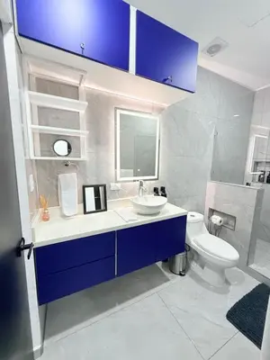 a bathroom with a sink and a toilet at Casa Azul Jaco in Jacó