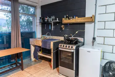 a kitchen with a stove and a sink at 31 Studio Apartment in Heredia