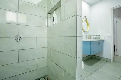 a bathroom with a shower with a glass door at Villa María - Perfect Getaway in Fortuna