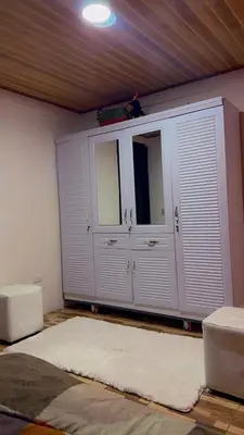 a room with white cabinets and a white rug at La Casa del Tucán in Puerto Limón