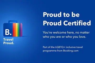 a sign that says proud certified with a suitcase at Tres Corazones in Carrillo