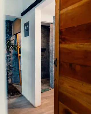 a door leading into a room with a bathroom at Luxury Villa Ceibo - Exquisite, Private, Serene in San Mateo