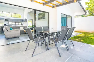 a dining room with a table and chairs at Uvita-Great location-3 bedroom-Private pool-Gated in Uvita