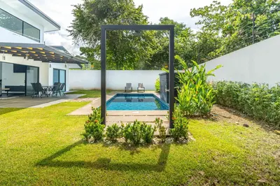 a swimming pool in the backyard of a house at Uvita-Great location-3 bedroom-Private pool-Gated in Uvita
