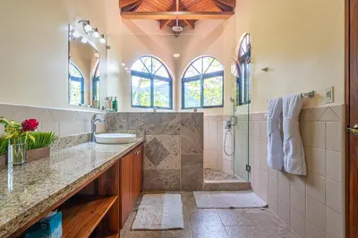 a bathroom with a sink and a shower at 4 bedroom-sleep 9-private pool-gated-Ojochal in Ojochal