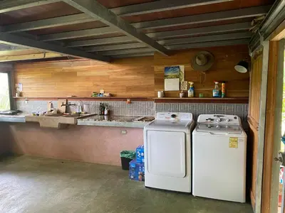 a kitchen with two refrigerators sitting next to each other at Casa Mariposa, Playa Ostional in Nosara