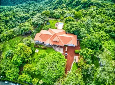 an overhead view of a large house with an orange roof at Finca Orgánica Sweet Home Mango in San Mateo