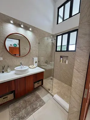 a bathroom with a sink and a shower with a mirror at Villa Montemar Ocean and Mountain Views Elevated 1200 FT with Wifi in Platanillo