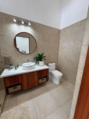 a bathroom with a sink and a toilet and a mirror at Villa Montemar Ocean and Mountain Views Elevated 1200 FT with Wifi in Platanillo
