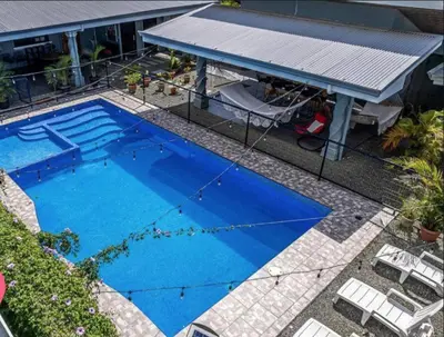 an overhead view of a large blue swimming pool at Casa Selva Viva in Uvita
