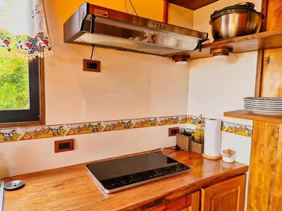 a kitchen with a sink and a stove top oven at House in the Clouds -Monteverde in Tilarán