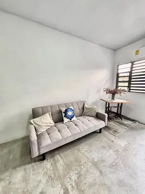 a living room with a couch and a table at Los Yoses Loft - Ideal for Long Stays in San Jose in San José