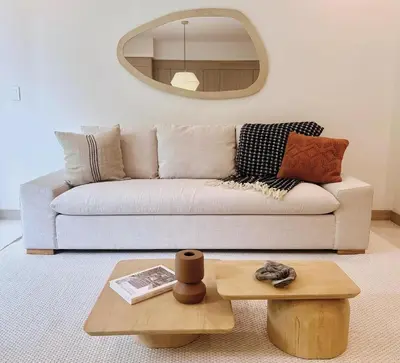 a living room with a couch and a table at Brisa del Valle at Naumi, Ocean Views & Beach Club in Sardinal