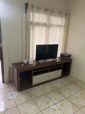 a television sitting on a table in a room at Pacayitas El Camino House in Turrialba