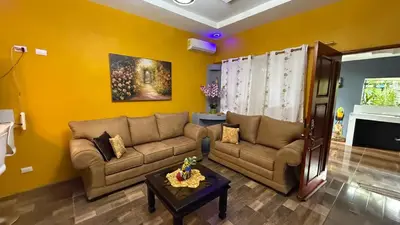 a living room with a couch and a table at Harmony Retreat in Fortuna