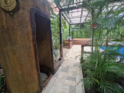 an open door to a garden with a pool at Harmony Retreat in Fortuna