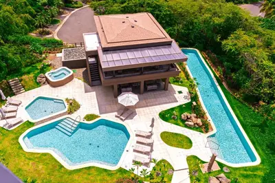an aerial view of a house with a swimming pool at Kamin Casa, Ocean Views & Beach Club in Sardinal