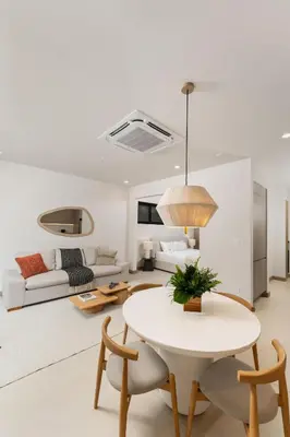 a living room with a table and a couch at Loma Mar at Naumi, Ocean Views & Beach Club in Sardinal