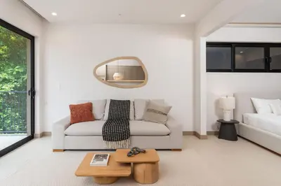 a living room with a couch and a table at Loma Mar at Naumi, Ocean Views & Beach Club in Sardinal