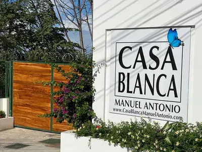 a sign that reads casa blanca in front of a garage at Casa Blanca Manuel Antonio B1, Central, Pool, Gated in Manuel Antonio