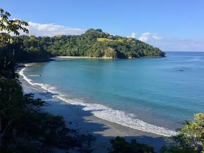 an island in the ocean with a sandy beach at El Titi, 1 Bedroom Ocean View Apartment, Central Location in Manuel Antonio