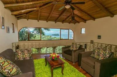 a living room with couches and a ceiling fan at El Congo, 2BR Apartment w Great Ocean Views and Central Location in Manuel Antonio
