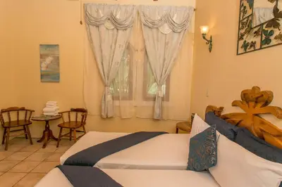 a bedroom with a bed and a window at El Congo, 2BR Apartment w Great Ocean Views and Central Location in Manuel Antonio