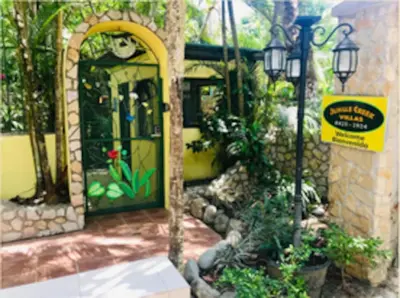 an entry to a house with a door with plants at Mono Vista At Jungle Creek Chill out in the Jungle in Manuel Antonio