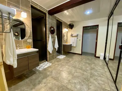 a large bathroom with a sink and a mirror at Mono Vista At Jungle Creek Chill out in the Jungle in Manuel Antonio