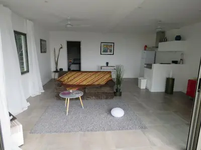 a living room with a couch and a table at Monteverde, 1 Bedroom Apartment in La Maison Blanche, Nature in Manuel Antonio