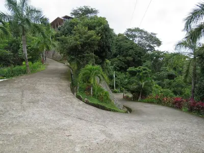 a dirt road in the middle of a forest at Monteverde, 1 Bedroom Apartment in La Maison Blanche, Nature in Manuel Antonio