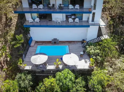 an aerial view of a villa with a swimming pool at Monteverde, 1 Bedroom Apartment in La Maison Blanche, Nature in Manuel Antonio