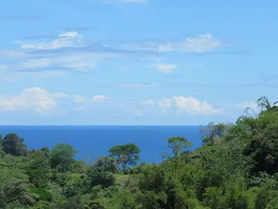 a view of the ocean from a hill at Guanacaste, 2 Bedroom Apartment in La Maison Blanche in Manuel Antonio