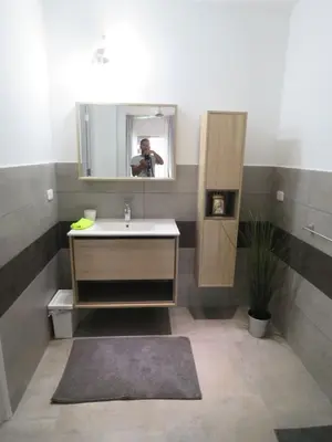 a man taking a picture of a bathroom with a sink at La Maison Blanche Nicoya, Pool, Views, and Wildlife in Manuel Antonio