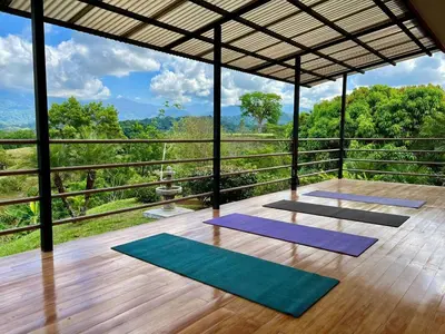 a group of yoga mats on a wooden floor at Finca Terra, Private Country Home, Mountain Views and Pool in Manuel Antonio