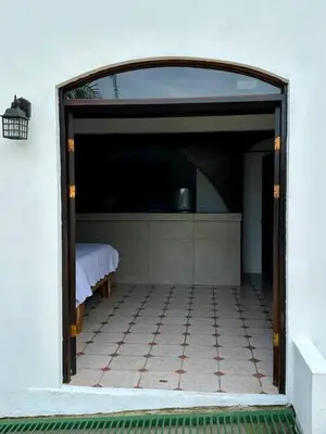an open door to a room with a bed at Casa Blanca Manuel Antonio B3, Central, Pool, Gated in Quepos