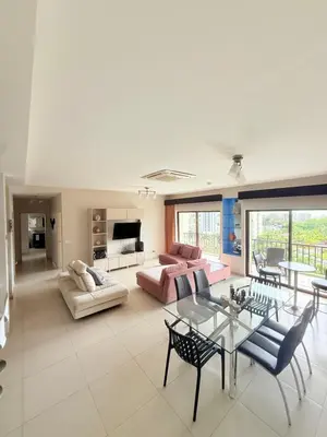 a large living room with a table and chairs at Jaco Bay Unit 8th Floor in Jacó