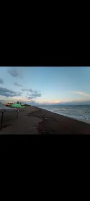 a view of a beach with a surfboard on the sand at No está disponible in Puntarenas