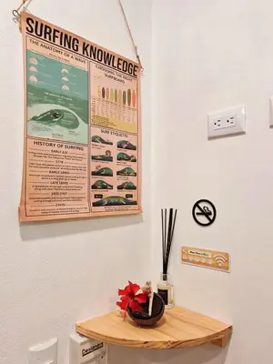 a sign on a wall above a wooden table at Moon Home SOUL #1 in Playa hermosa